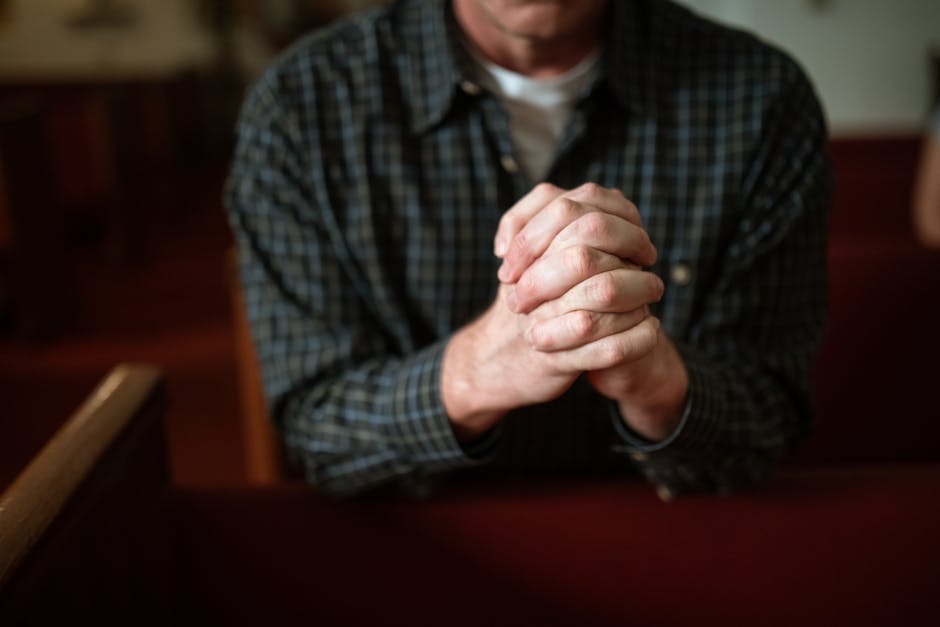 Clasped hands in prayer